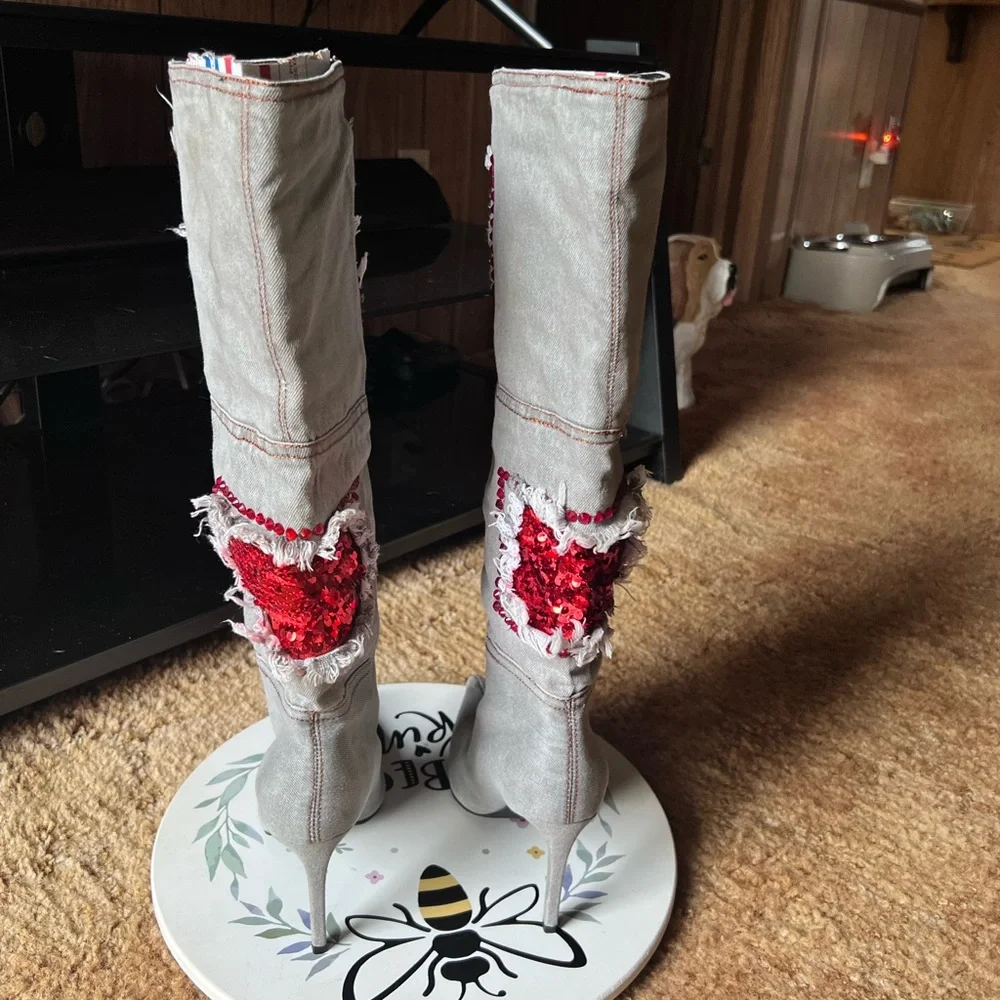 Woman’s multi-color red stone denim pointy toe knee-high boots.